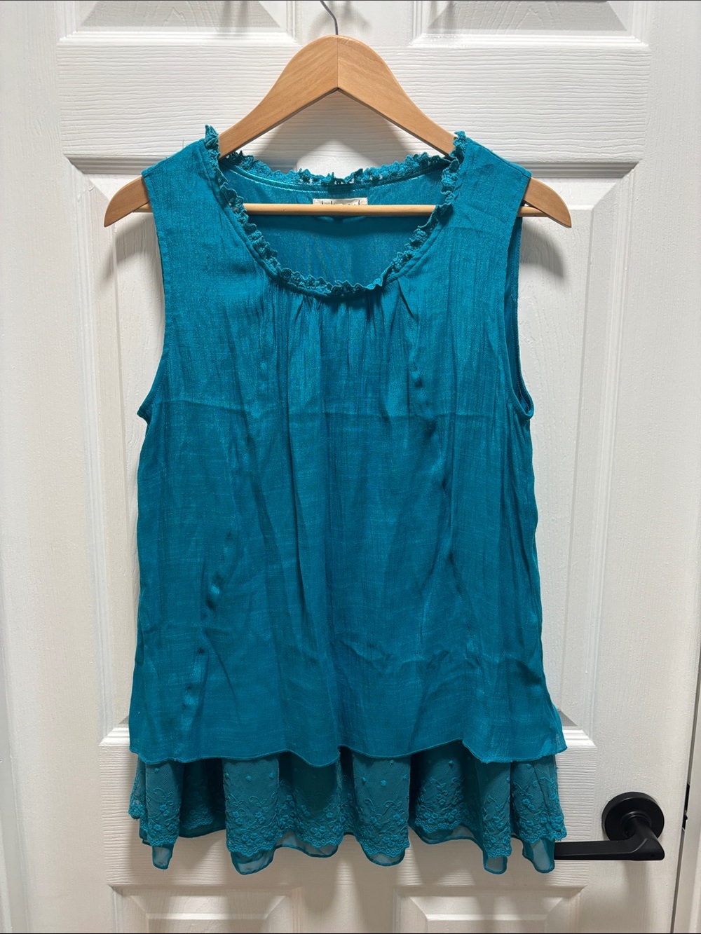 indigo soul Teal Layered Ruffle Neck Tank/The color is teal/turquoise.